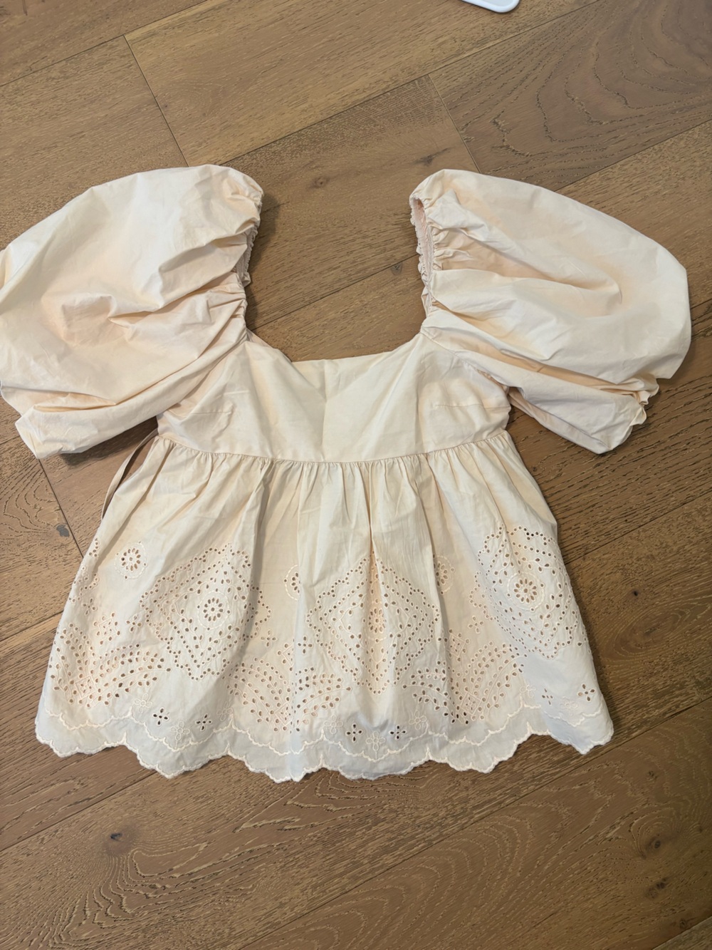 Moon River Puff Sleeve Eyelet Peplum Top in Pale Peach